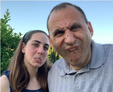 Emily Judith Mitnick in the orchard making a silly face.