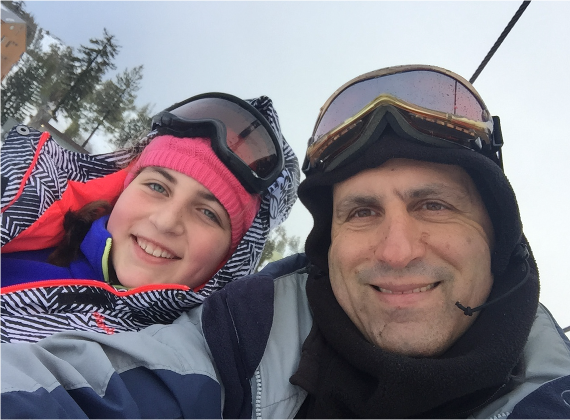 Emily Mitnick on the lift, resting and enjoying the view